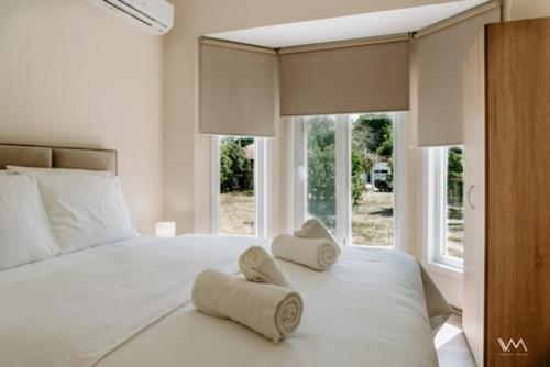 Ένα ή περισσότερα κρεβάτια σε δωμάτιο στο Oikies Verde