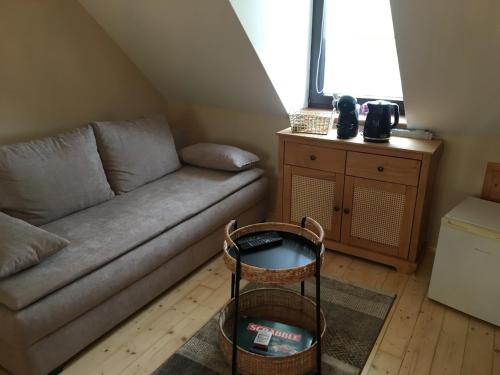a living room with a couch and a table at Apartmán Juli in Tatranská Lomnica