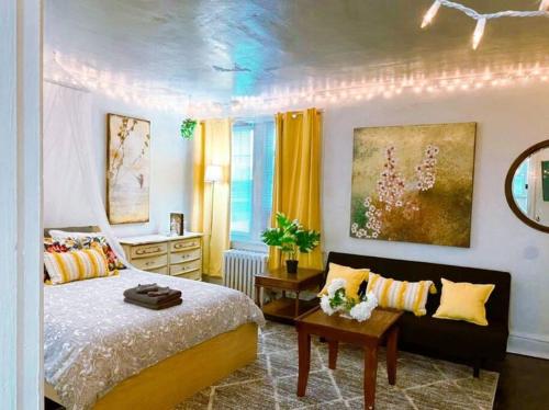 a bedroom with a bed and a table and a window at (49.1E) Garden style studio @ Forest Park & City! in Benton