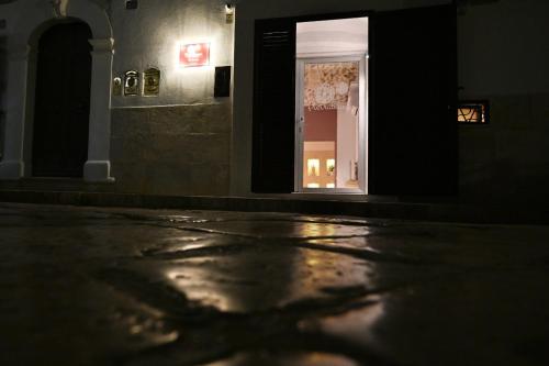 a shadow of a tree on the floor of a building at Pietrabianca Apartments San Lorenzo in Manfredonia