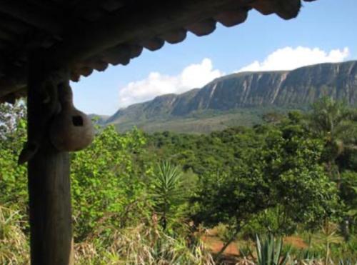 a view of a mountain from a house with a face on it at Sitio Canto da Serra - Serra da Canastra in São Roque de Minas