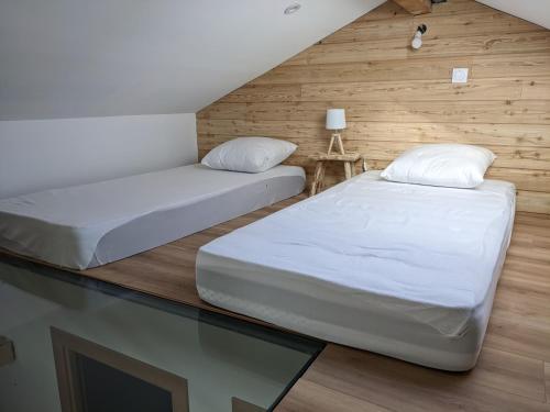 מיטה או מיטות בחדר ב-Appartemment type chalet