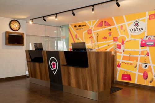 an office with a reception desk with a map at Centro by Casa Andina Miraflores in Lima