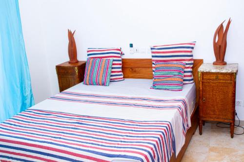 Ein Bett oder Betten in einem Zimmer der Unterkunft RESIDENCE rubis