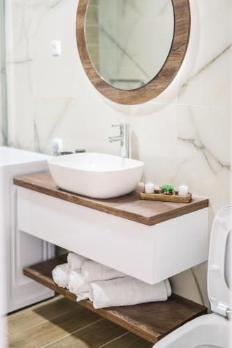 a bathroom with a sink and a mirror at Vila katune 2022 in Ulcinj