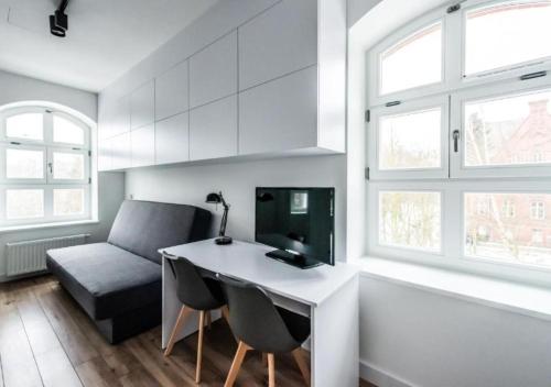 Televízia a/alebo spoločenská miestnosť v ubytovaní Apartamenty Do Studzienki 65