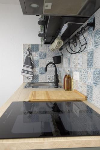 a kitchen with a sink and a counter top at Apartma Licko in Domžale