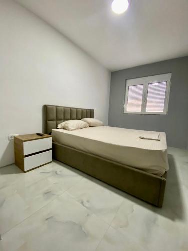 Ένα ή περισσότερα κρεβάτια σε δωμάτιο στο Etna Apartments