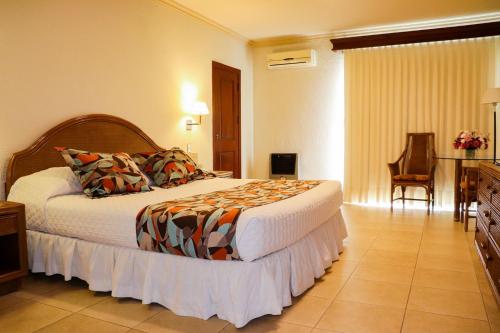Ένα ή περισσότερα κρεβάτια σε δωμάτιο στο Hotel Los Parrales