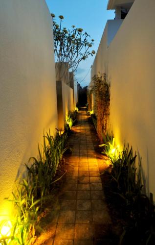 an alley with lights on the side of a building at Jas Boutique Villas in Seminyak