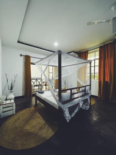 a large cage in a room with a living room at Crystal Beach Nungwi in Nungwi