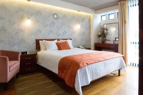 A bed or beds in a room at Suites Metropoli