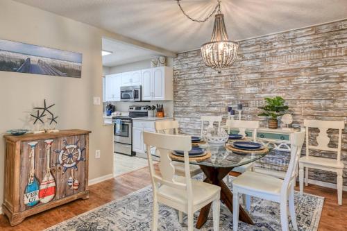 a kitchen and dining room with a table and chairs at Sea Turtle Shores in St. Augustine