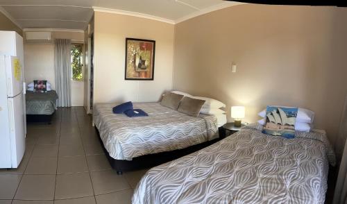 Ένα ή περισσότερα κρεβάτια σε δωμάτιο στο Childers Budget Accommodation