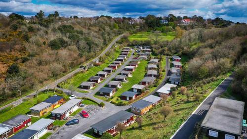 an aerial view of a parking lot with parked cars at Caswell Beach Chalet 70 located in Gower Peninsula in Swansea