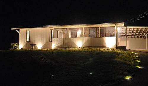 a house with lights on the side of it at night at Stay at The Retreat! Gatlinburg-Dollywood in Sevierville