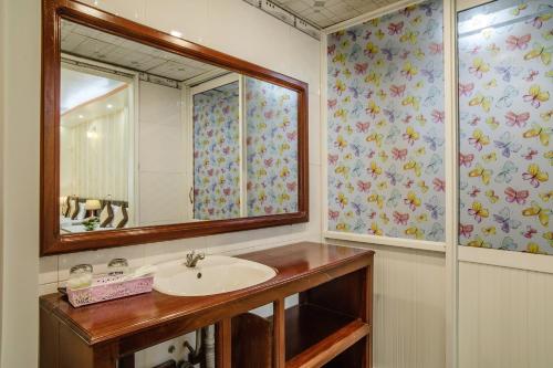 a bathroom with a sink and a mirror at Dong Bao Hotel in Chau Doc