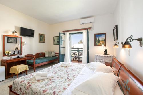 Postel nebo postele na pokoji v ubytování Apollon Hotel