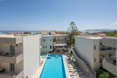 an aerial view of a building with a swimming pool at Summer Beach Hotel in Georgioupoli
