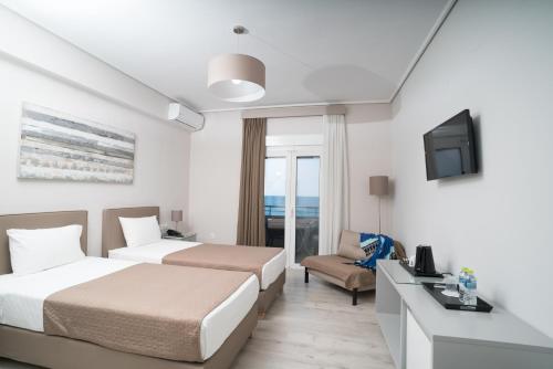Postel nebo postele na pokoji v ubytování Hotel Alkyon