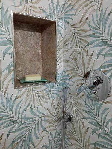 a bathroom with a mirror and a shower at VETULONIA ROMANTICA in Vetulonia