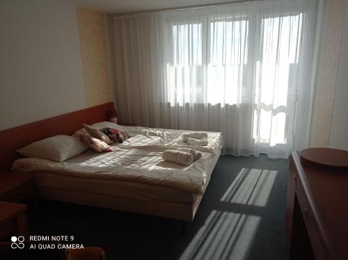 Cama ou camas em um quarto em Kryształowa Przystań