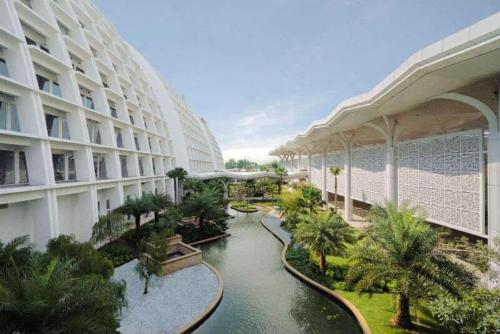 a building with a river in the middle of it at AziziYati Muslem Homestay KLIA Sepang - SemiD House in Sepang
