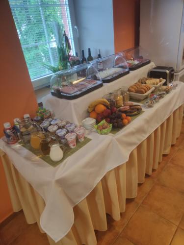 a long table with a buffet of food on it at B&B Royal Liberty in Ústí nad Labem