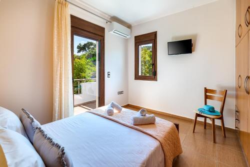 Un pat sau paturi într-o cameră la Villa Alexandra