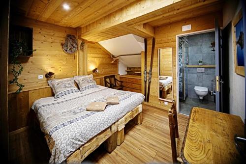 Кровать или кровати в номере Lodge La Tuvière
