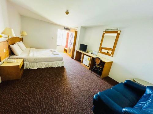 Postel nebo postele na pokoji v ubytování Sweet Home Hotel Betong