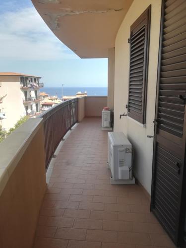 a balcony with a toilet on the side of a building at Appartamenti Scilla Paese Albergo in Scilla