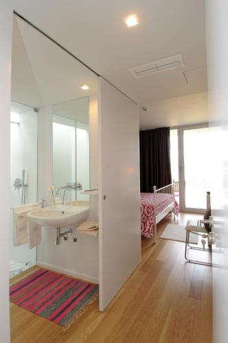 a bathroom with a sink and a mirror at Quinta Pedras De Baixo in Longos