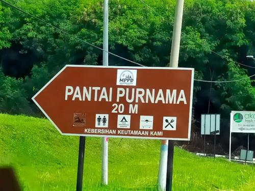 un signe brun indiquant pantinian pumma nm dans l'établissement Homestay Wadi A5-5-4 @ Laguna Condo Resort, à Port Dickson