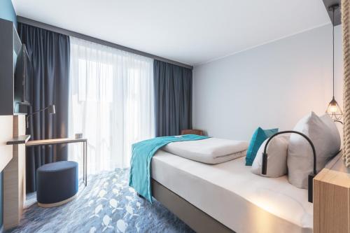 Postel nebo postele na pokoji v ubytování Holiday Inn - the niu, Yen Hamburg City by IHG