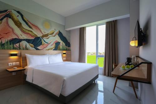 מיטה או מיטות בחדר ב-favehotel Pamanukan