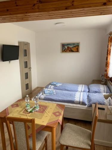 A bed or beds in a room at Privat Železný Brod