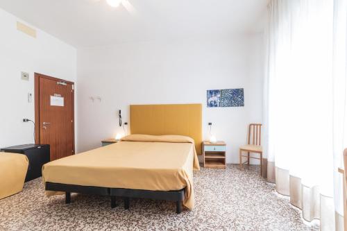 a bedroom with a bed in a room at B&B Moresco in Cattolica