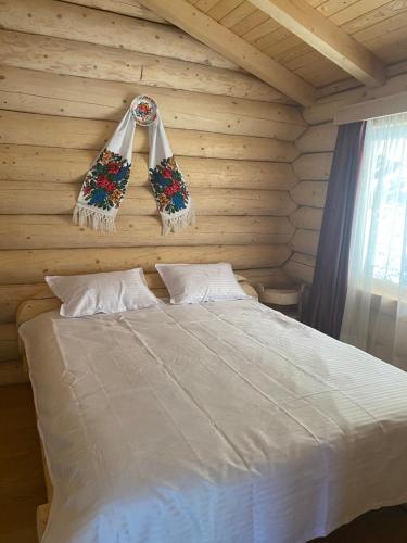 Katil atau katil-katil dalam bilik di Cabana De Vis Pietrosul