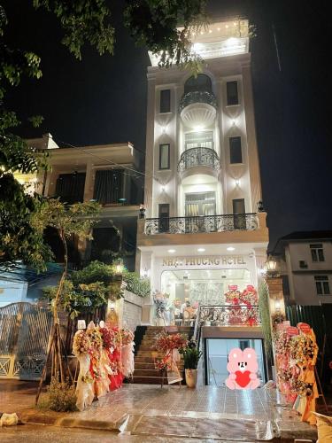 a store with a hello kitty sign in front of a building at Nhật Phương Hotel in Hue