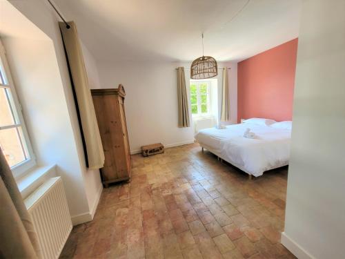 Postel nebo postele na pokoji v ubytování Château des Vierres