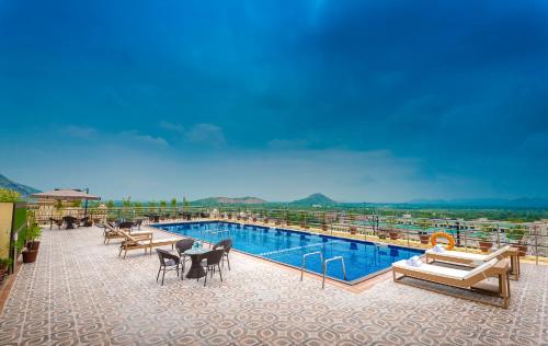 a large swimming pool on top of a building at Clarion Inn Jaipur in Jaipur