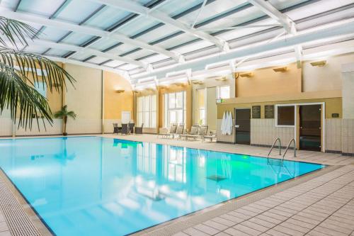 a large swimming pool in a building at Gleddoch Golf & Spa Resort in Langbank