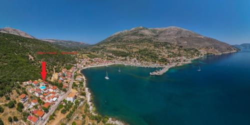 an aerial view of a small island in the water at MAKIS VILLAGE-APARTMENTS in Ayia Evfimia