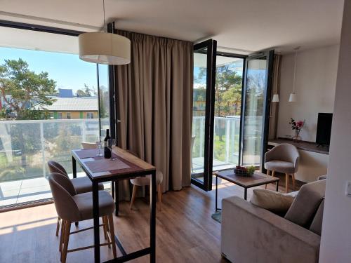 Posezení v ubytování Apartamenty Szafirowe w Mielnie