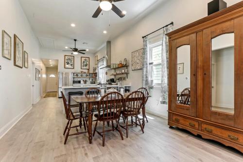 a kitchen and dining room with a table and chairs at Renovated Historic 4BR House Near Magazine St & Uptown in New Orleans