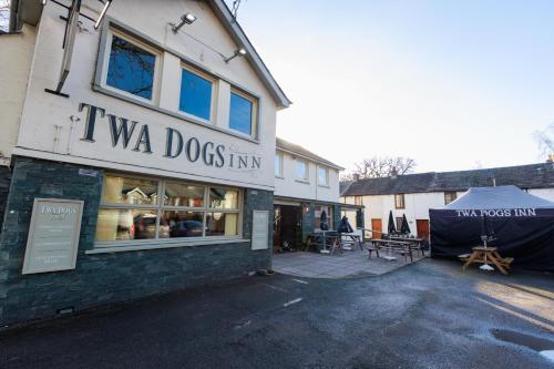 a building with a sign that reads i va dogs inn at Twa Dogs Inn in Keswick