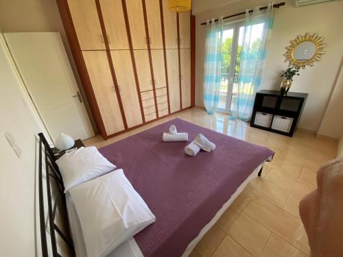 Postel nebo postele na pokoji v ubytování Siamos Villa