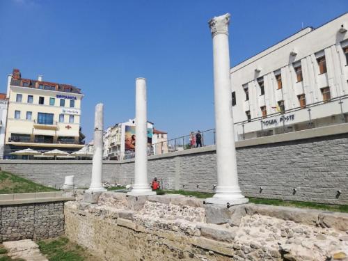 a group of columns in front of a building at Sunflower Apartment City Center in Plovdiv
