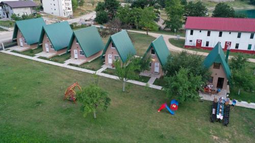 an aerial view of a house with a playground at Bungalow Holiday in Pluzine